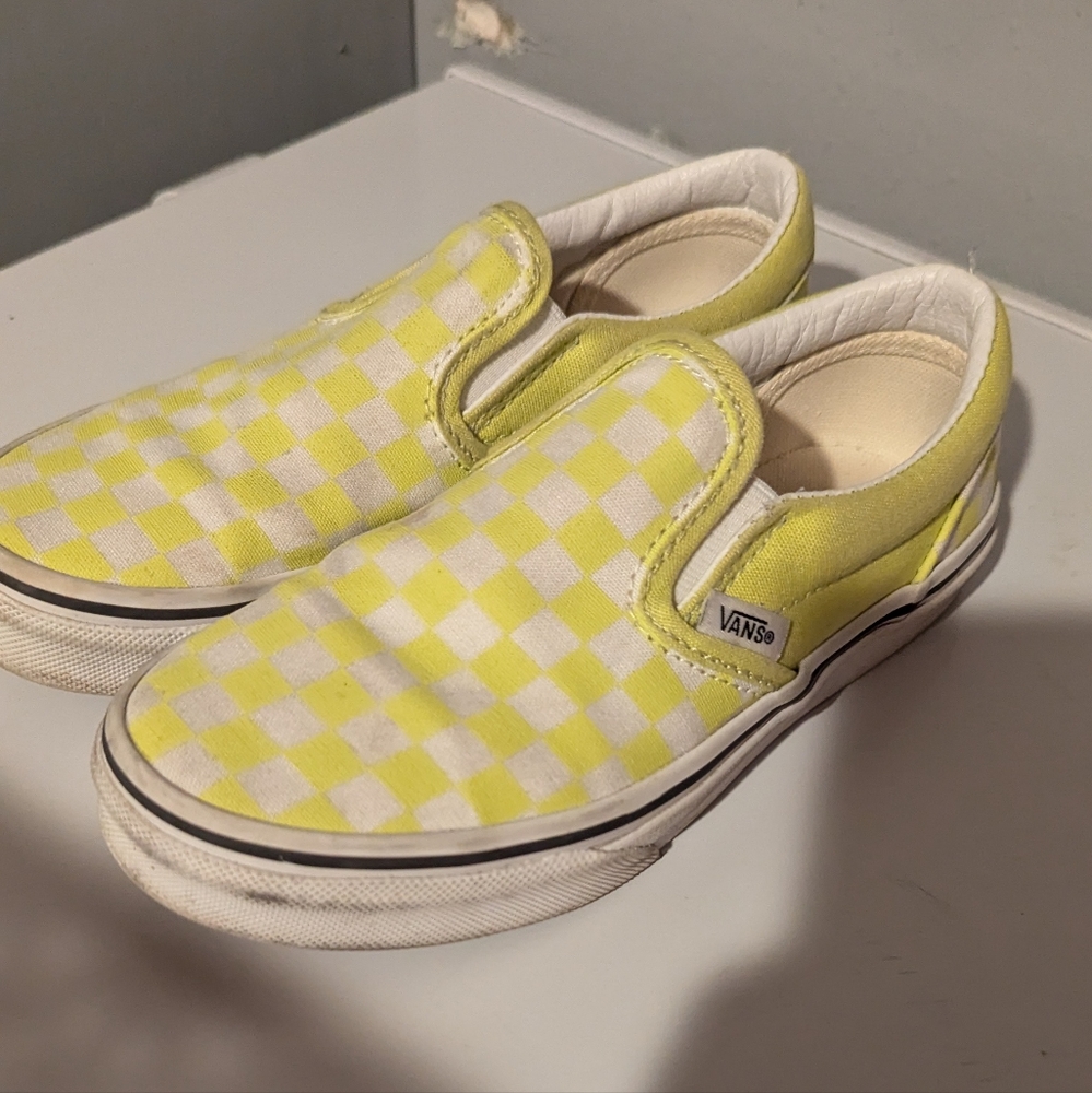 Yellow checkered Vans classic slip ons